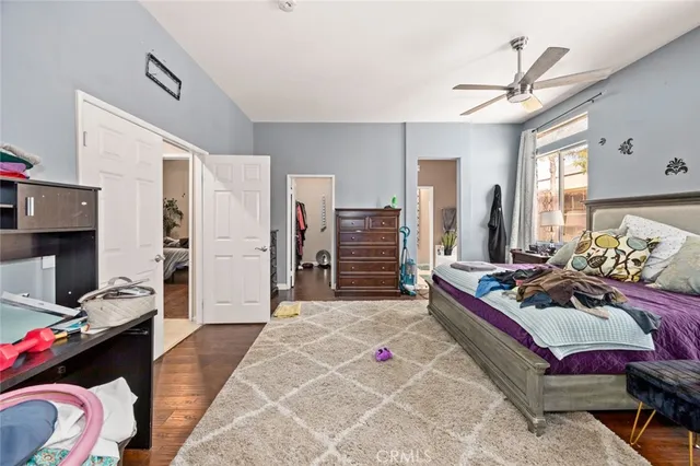 a bedroom with a bed closet and a window