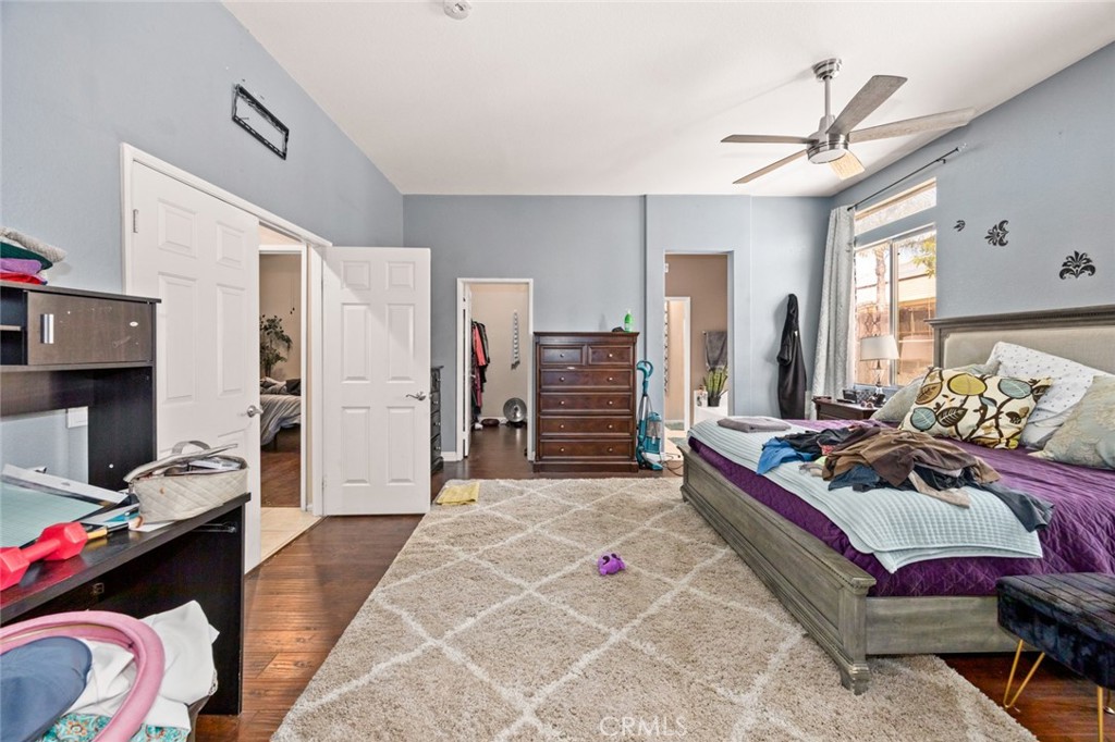 410 Windfields Way Beaumont, CA 92223 - Photo 15 of 41 a bedroom with a bed closet and a window