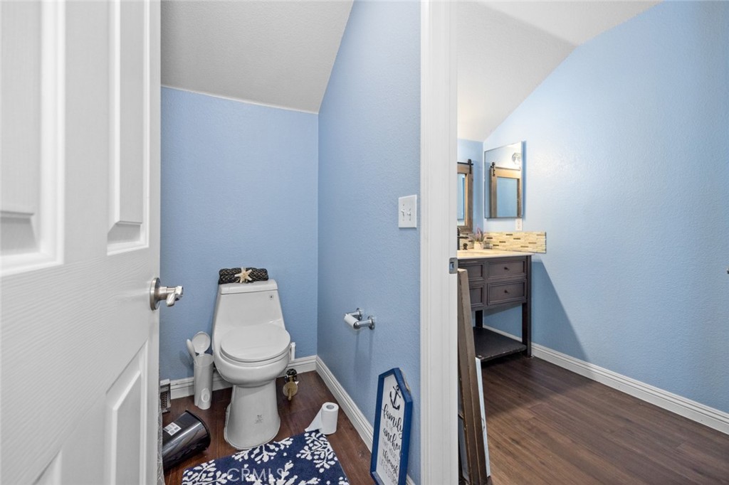 410 Windfields Way Beaumont, CA 92223 - Photo 22 of 41 a bathroom with a toilet and a sink