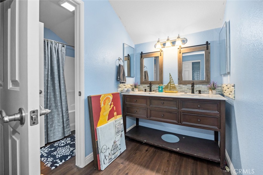410 Windfields Way Beaumont, CA 92223 - Photo 23 of 41 a bathroom with a sink a vanity and a mirror