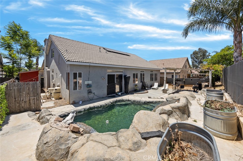 410 Windfields Way Beaumont, CA 92223 - Photo 35 of 41 a view of a house with backyard and sitting area
