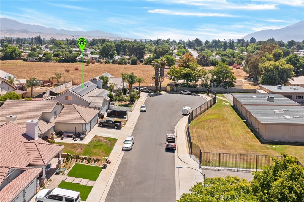 410 Windfields Way Beaumont, CA 92223 - Photo 36 of 41 an aerial view of a house with a swimming pool and mountains