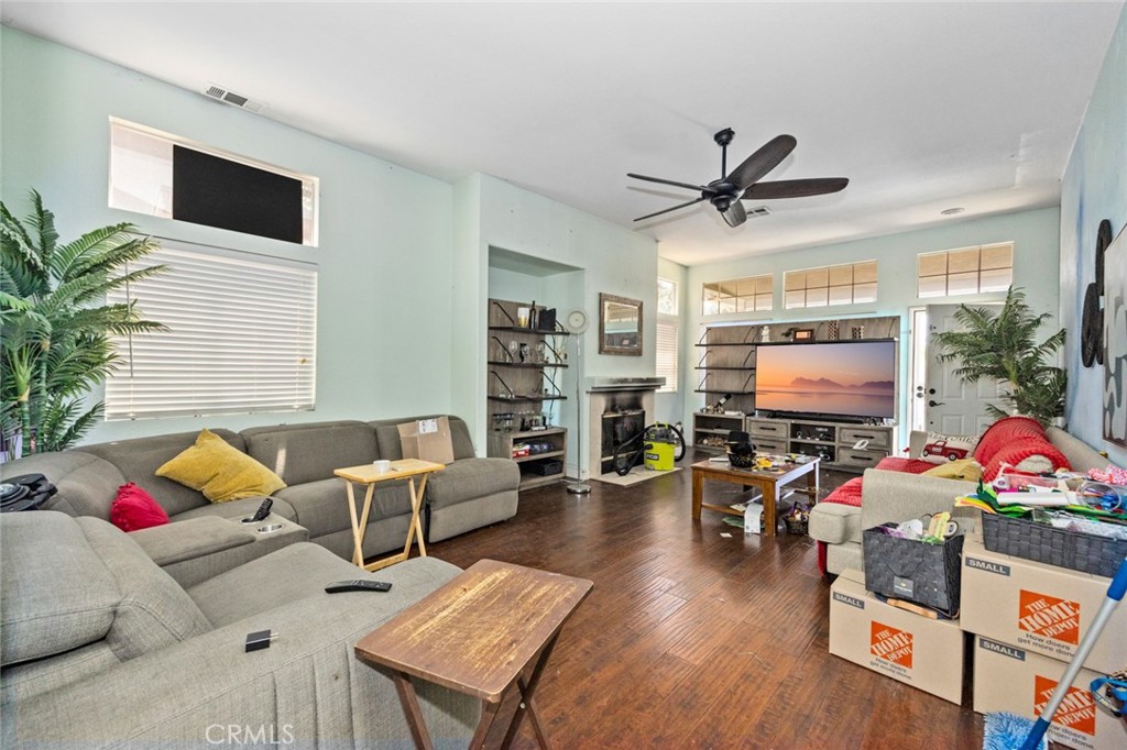 410 Windfields Way Beaumont, CA 92223 - Photo 4 of 41 a living room with furniture and a flat screen tv