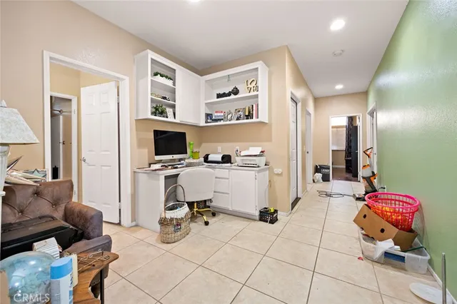 a view of a livingroom with workspace and a couch