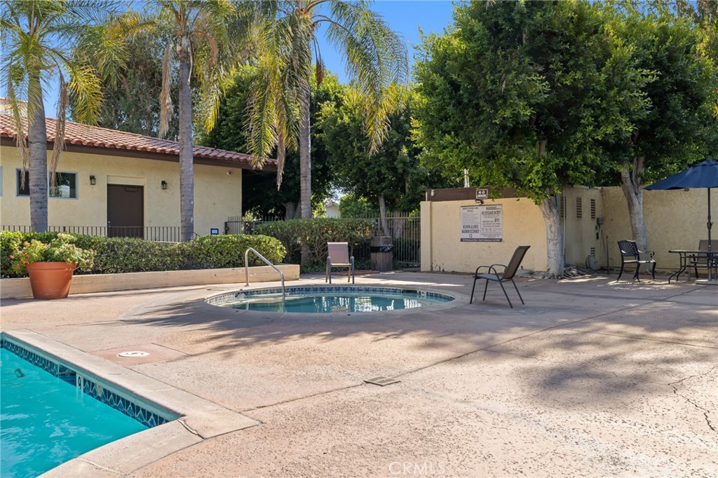 12830 Burbank Boulevard, Unit 307 Valley Village, CA 91607 - Photo 18 of 25 a view of a house with backyard and sitting area