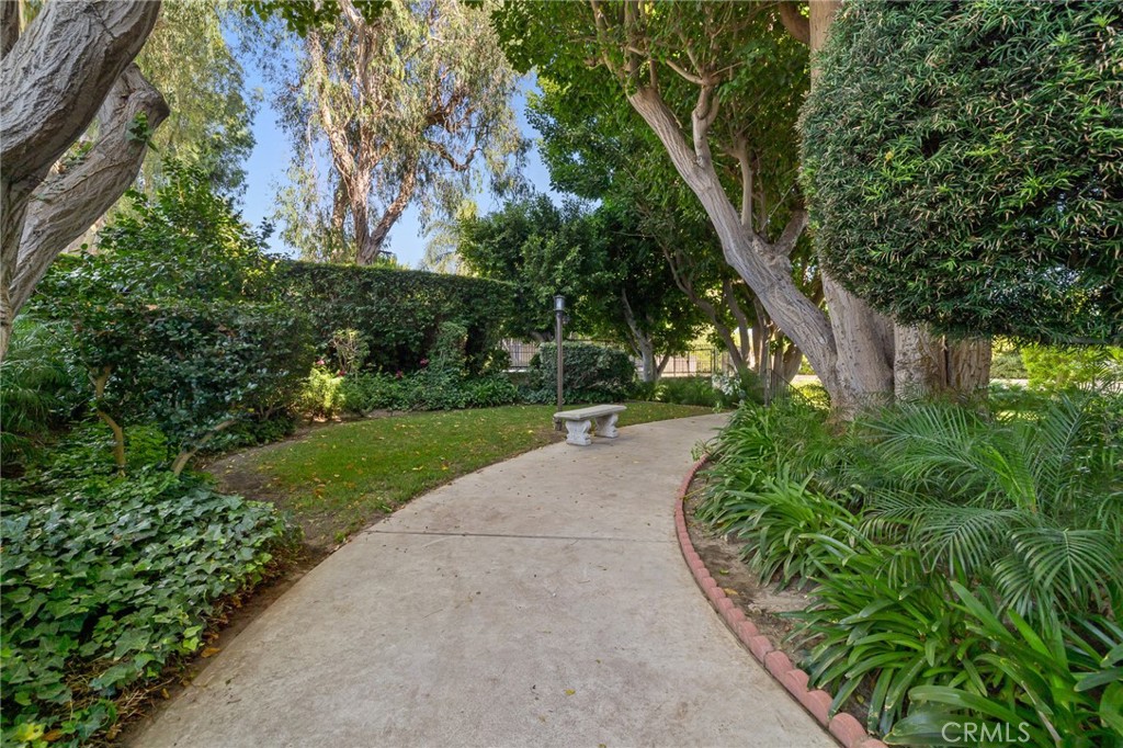 12830 Burbank Boulevard, Unit 307 Valley Village, CA 91607 - Photo 24 of 25 a view of a garden with plants and large trees
