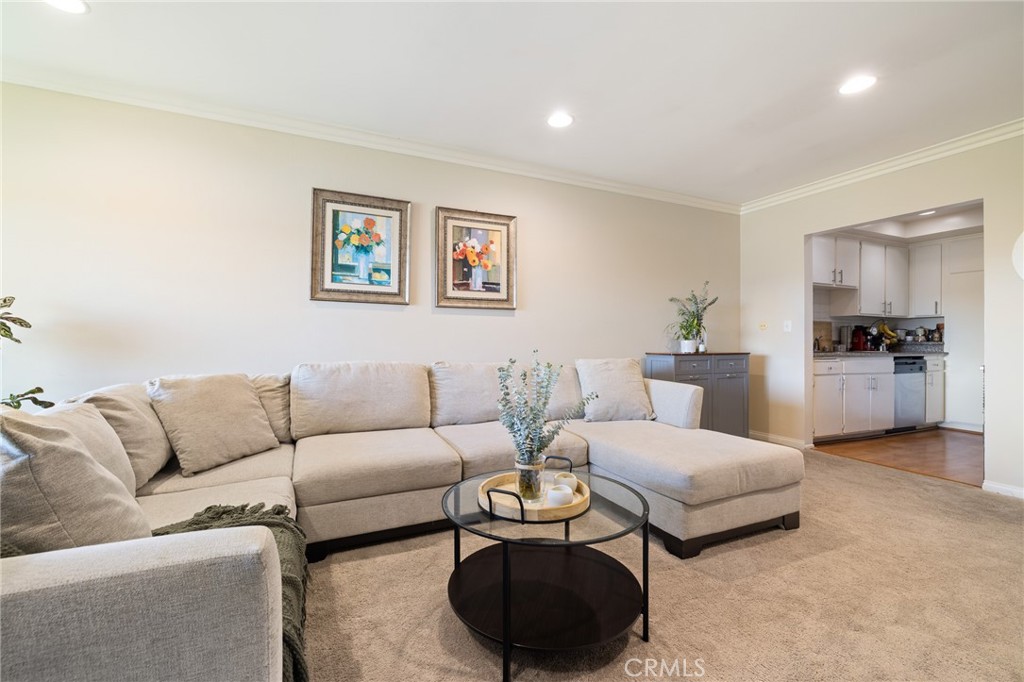12830 Burbank Boulevard, Unit 307 Valley Village, CA 91607 - Photo 5 of 25 a living room with furniture and a couch