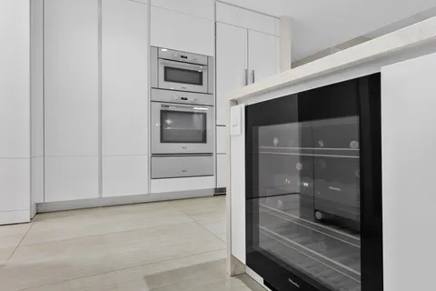a bathroom with a sink toilet and mirror