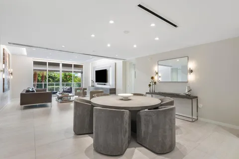 a living room with couches and a flat screen tv