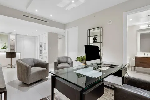 a en suite bathroom with a double vanity sink a mirror and a shower