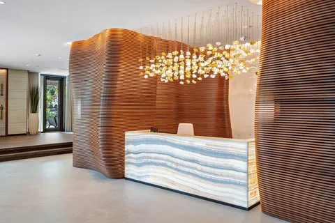 a kitchen with a table chairs refrigerator and cabinets