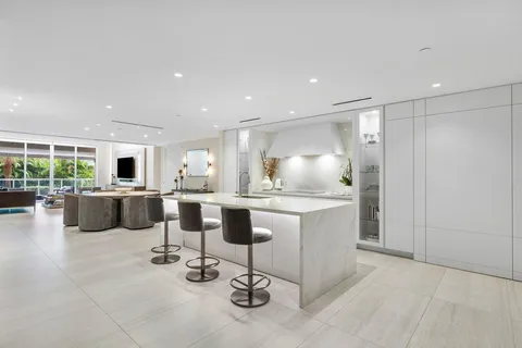 a view of a kitchen with a sink stove and refrigerator