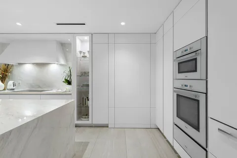 a utility room with sink dryer and washer