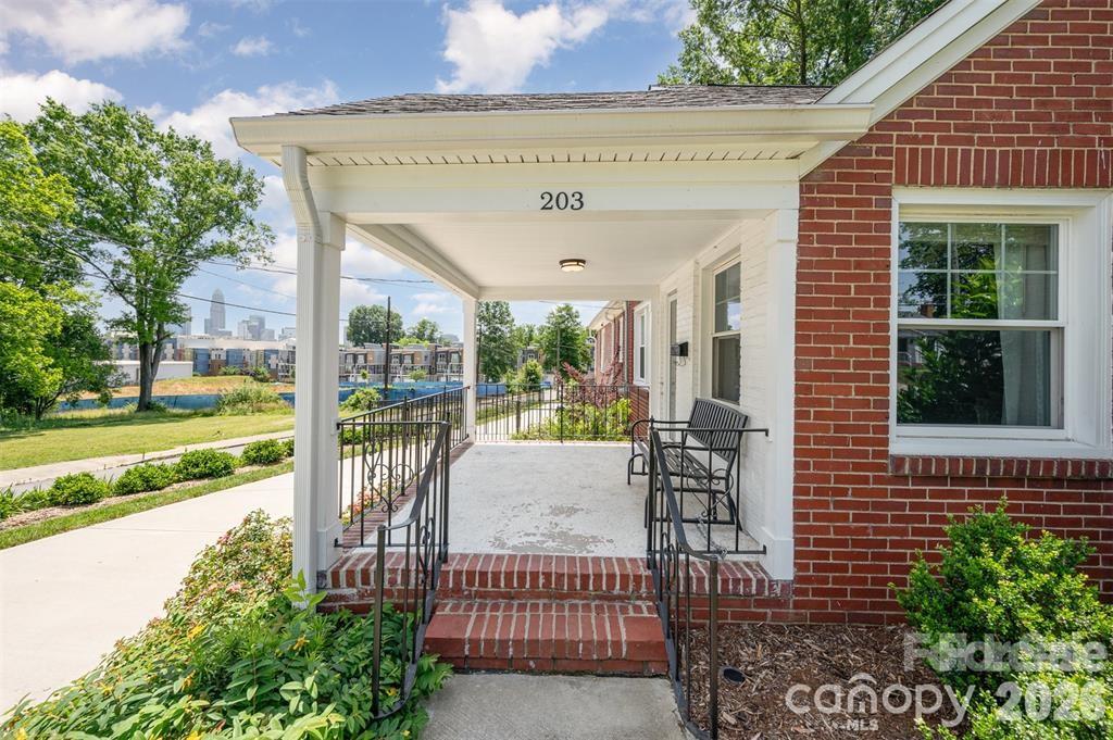 203 State Street Charlotte, NC 28208 - Photo 2 of 13 a view of a patio with a table chairs and a patio