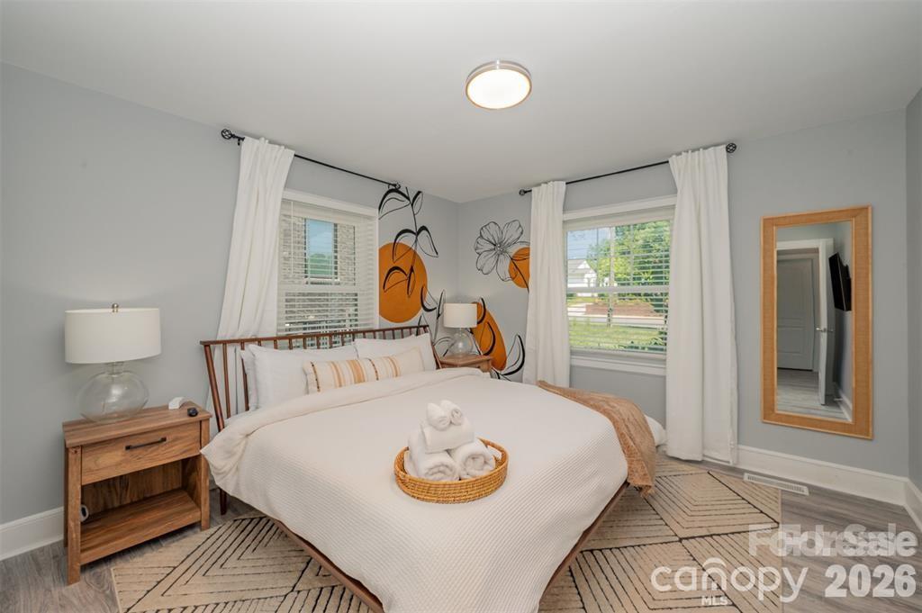 203 State Street Charlotte, NC 28208 - Photo 6 of 13 a bed sitting in a bedroom next to a window