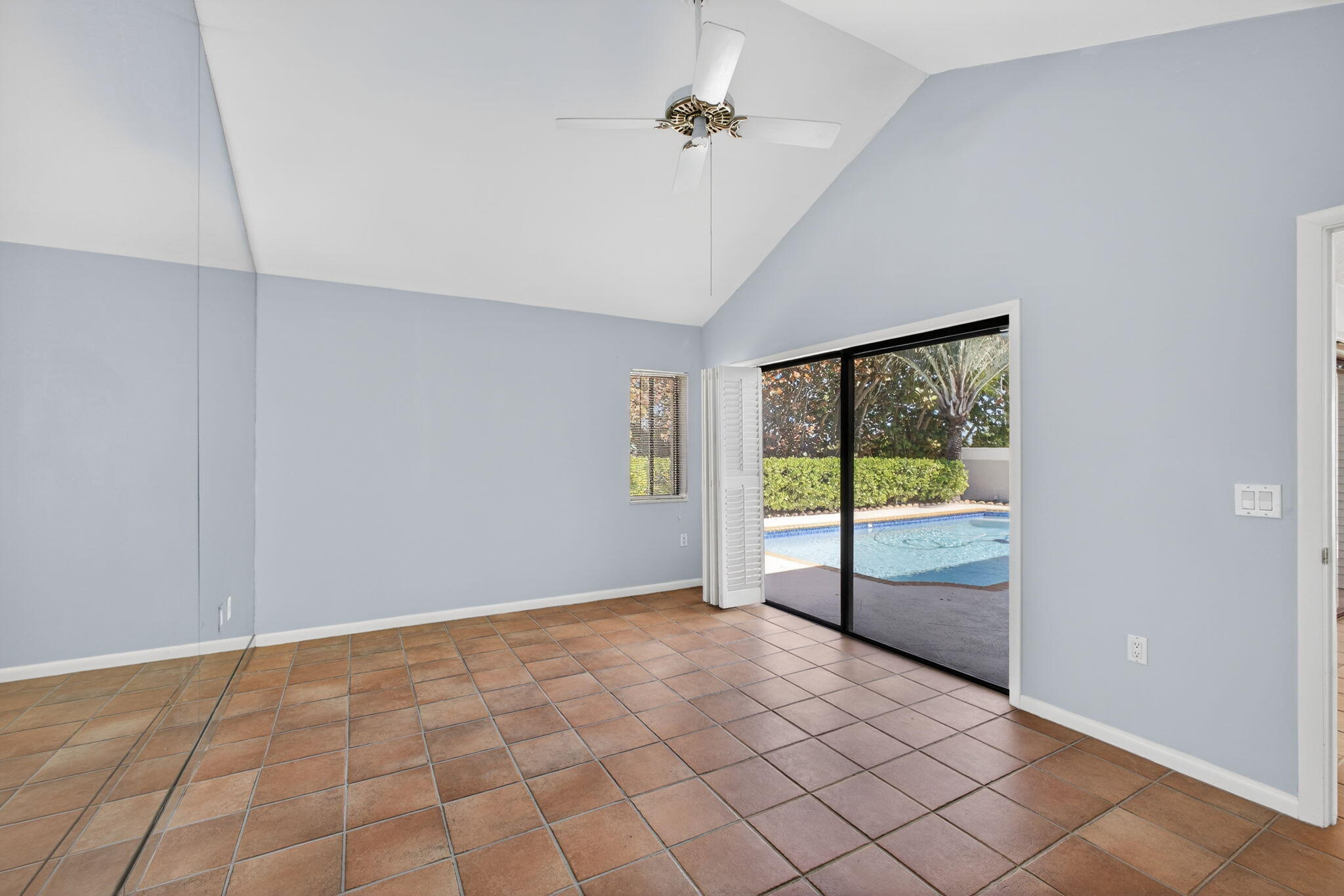 239 Ridge Road Jupiter, FL 33477 - Photo 32 of 75 a view of an empty room with a window