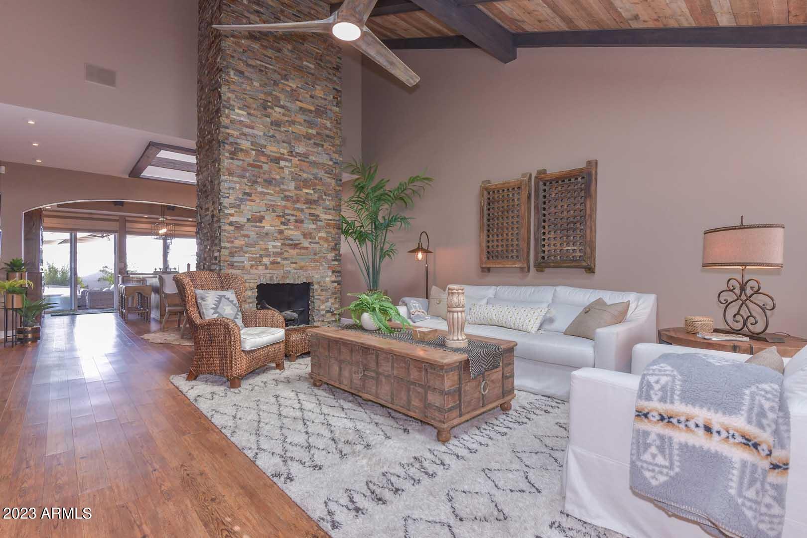 5804 North Scottsdale Road Paradise Valley, AZ 85253 - Photo 14 of 42 a living room with furniture and a fireplace