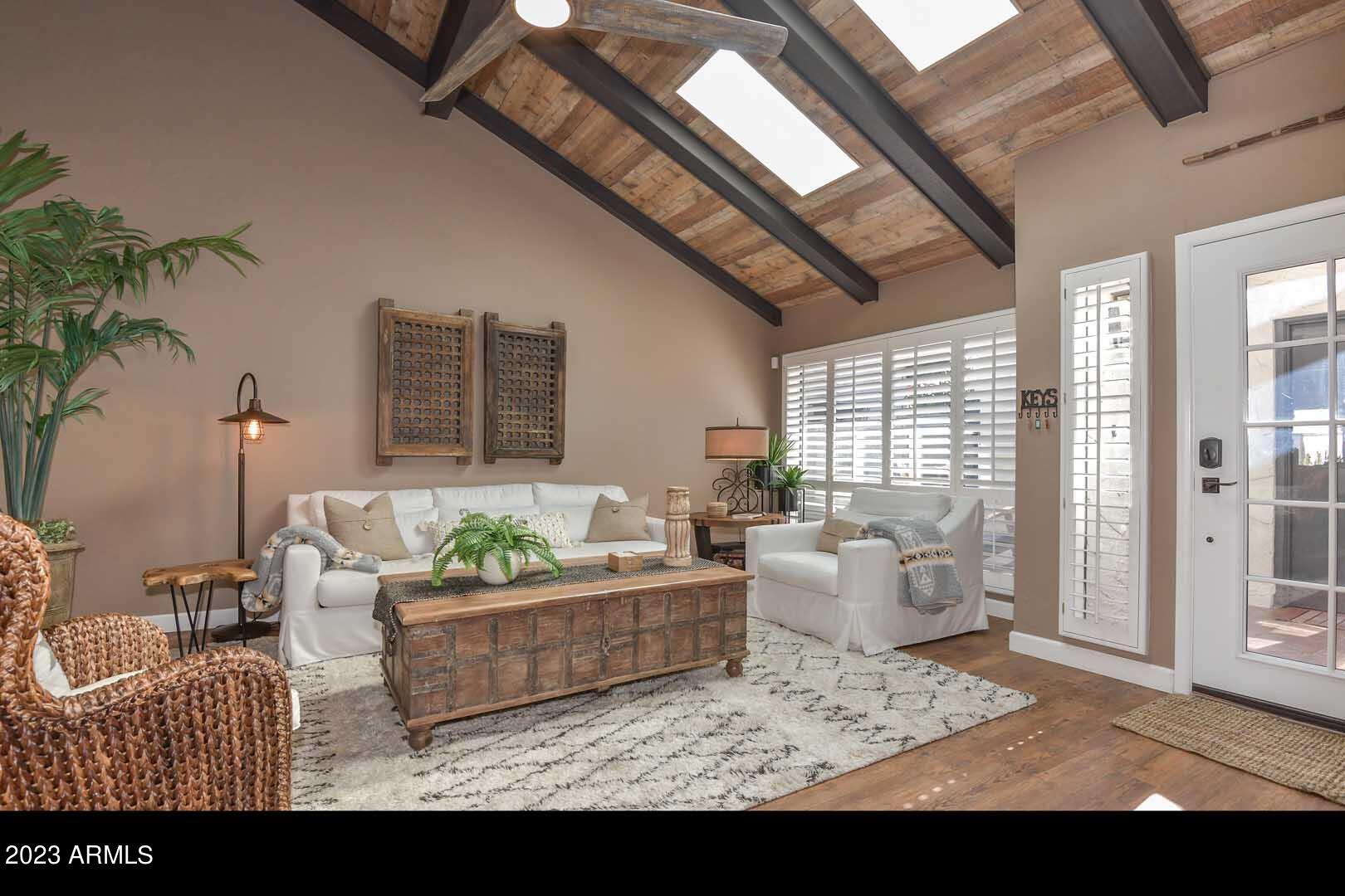 5804 North Scottsdale Road Paradise Valley, AZ 85253 - Photo 15 of 42 a living room with furniture and a potted plant