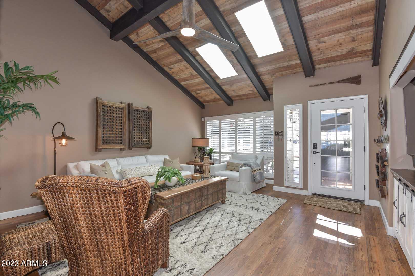 5804 North Scottsdale Road Paradise Valley, AZ 85253 - Photo 16 of 42 a living room with furniture and wooden floor