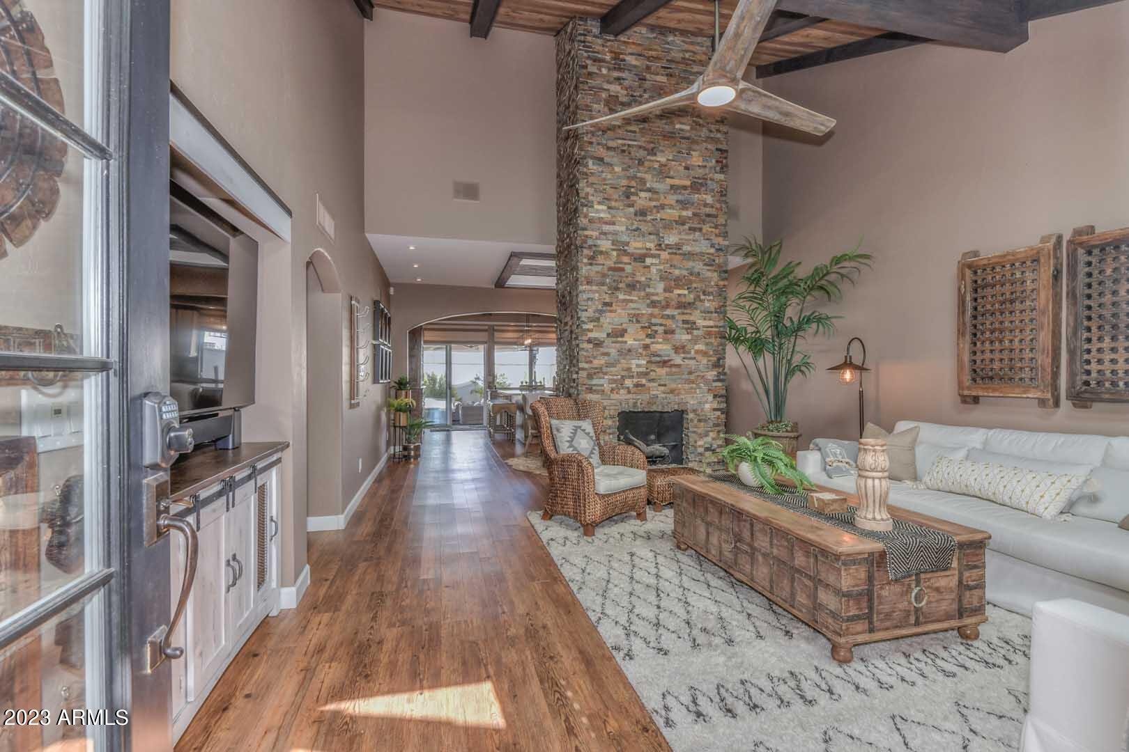 5804 North Scottsdale Road Paradise Valley, AZ 85253 - Photo 17 of 42 a living room with furniture wooden floor and a chandelier