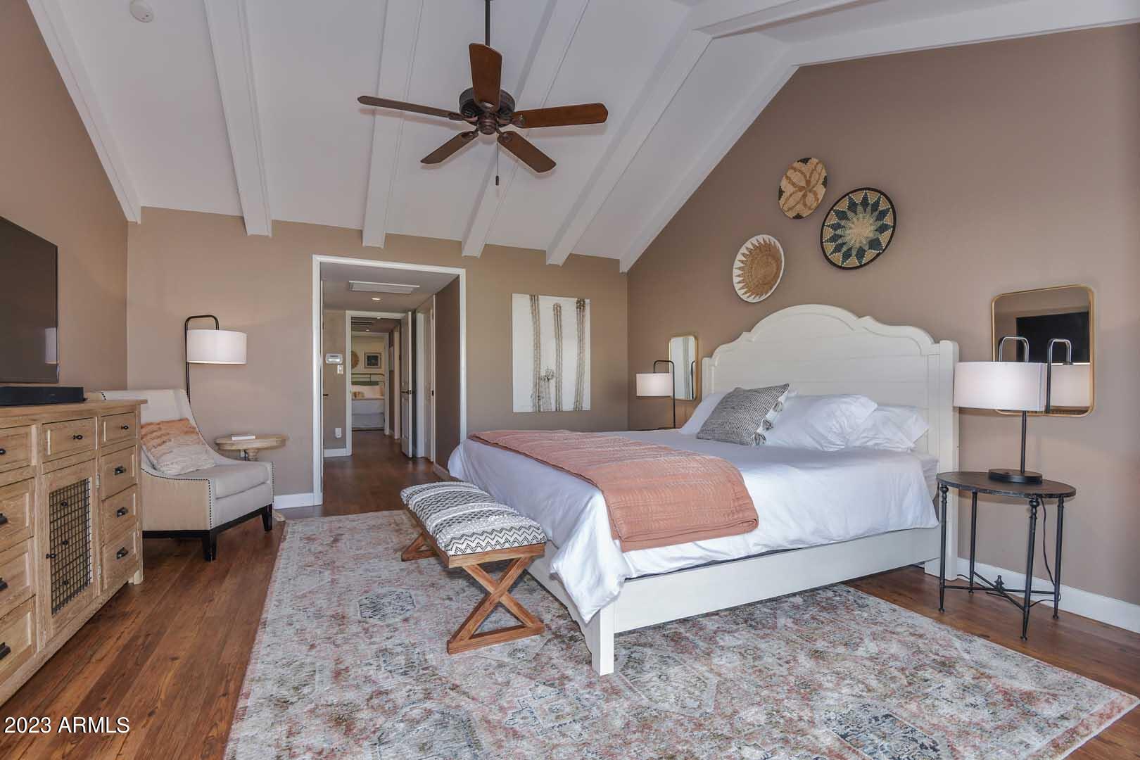 5804 North Scottsdale Road Paradise Valley, AZ 85253 - Photo 20 of 42 a bedroom with a bed and wooden floor