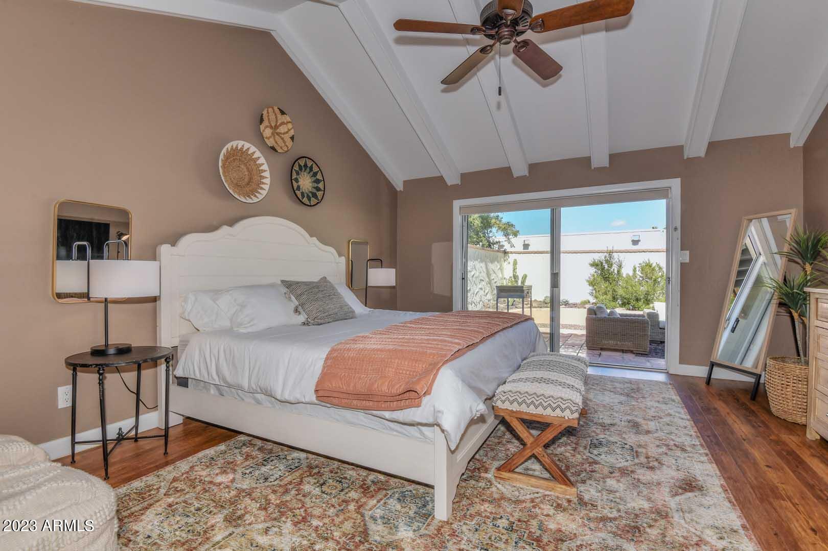 5804 North Scottsdale Road Paradise Valley, AZ 85253 - Photo 21 of 42 a bedroom with a bed and a chandelier