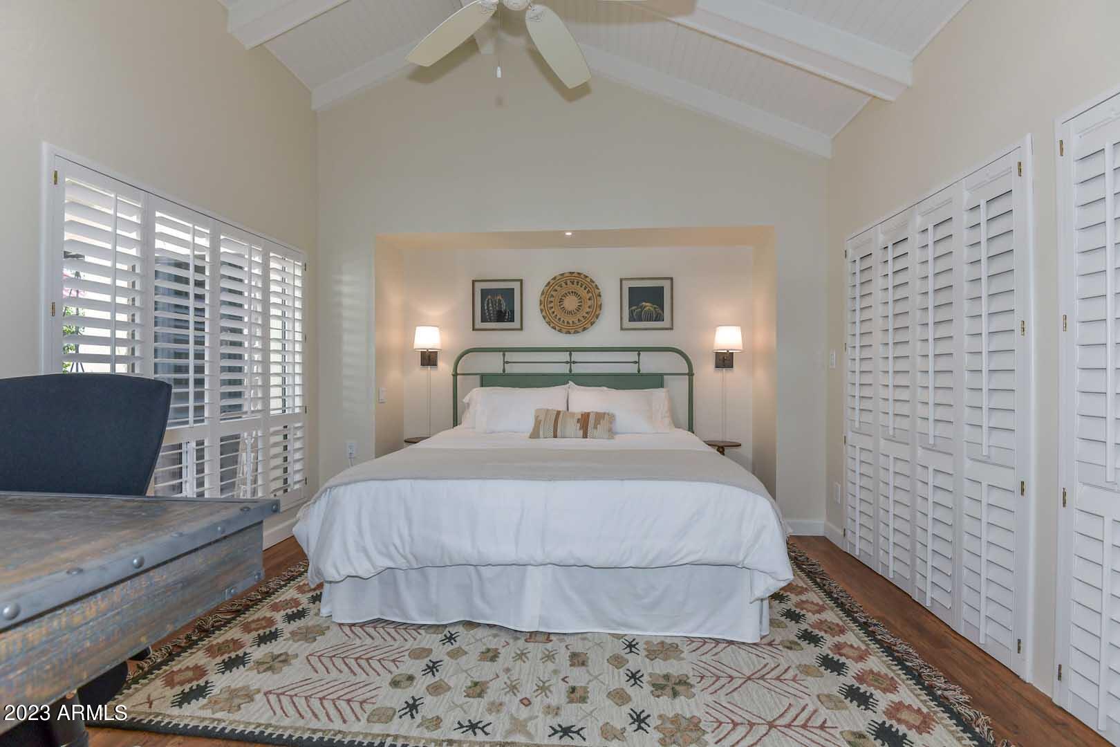 5804 North Scottsdale Road Paradise Valley, AZ 85253 - Photo 33 of 42 a bedroom with a bed and wooden floor