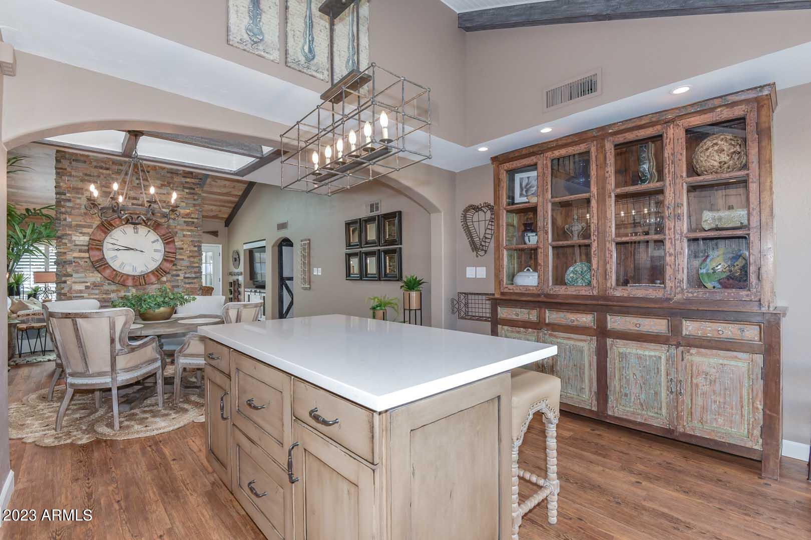 5804 North Scottsdale Road Paradise Valley, AZ 85253 - Photo 7 of 42 a view of a dining room with furniture a chandelier and wooden floor