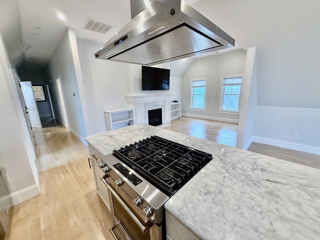 28 Dix Street, Unit 3 Boston, MA 02122 - Photo 18 of 34 a kitchen with a stove and a microwave