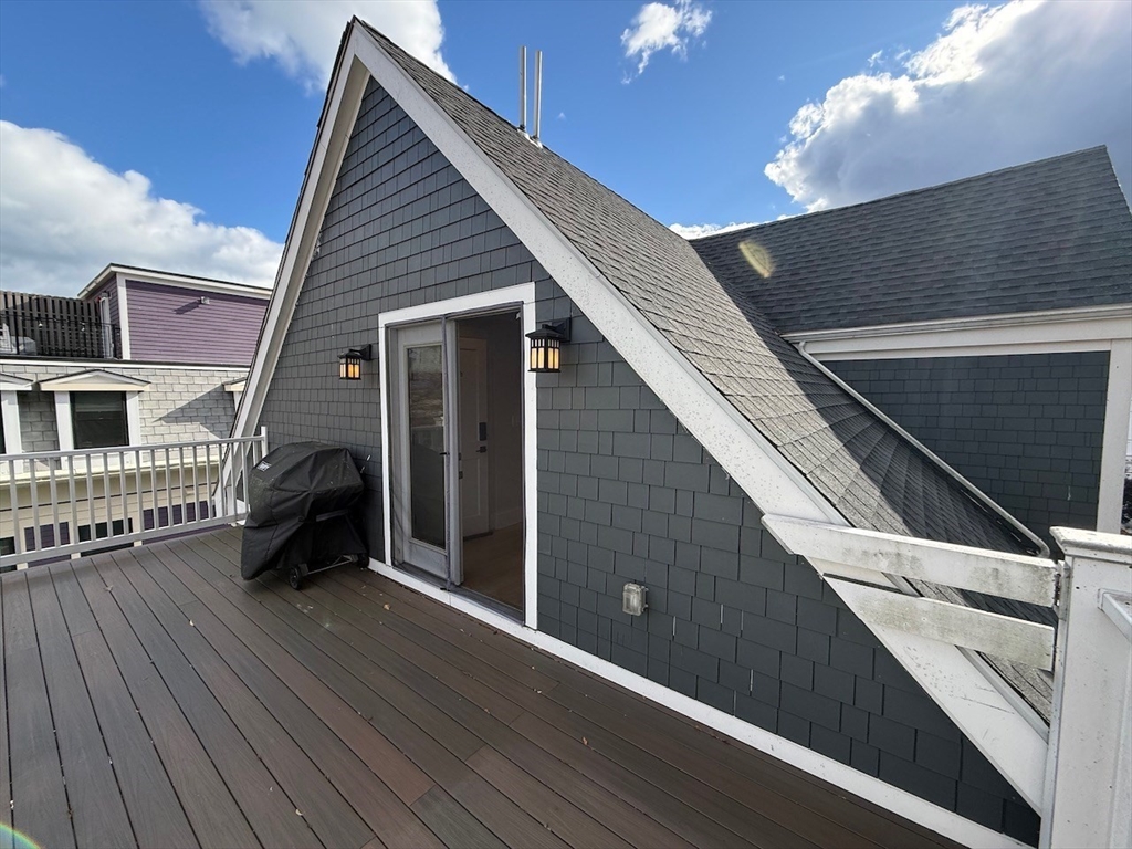 28 Dix Street, Unit 3 Boston, MA 02122 - Photo 28 of 34 a backyard of a house with barbeque oven and barbeque oven