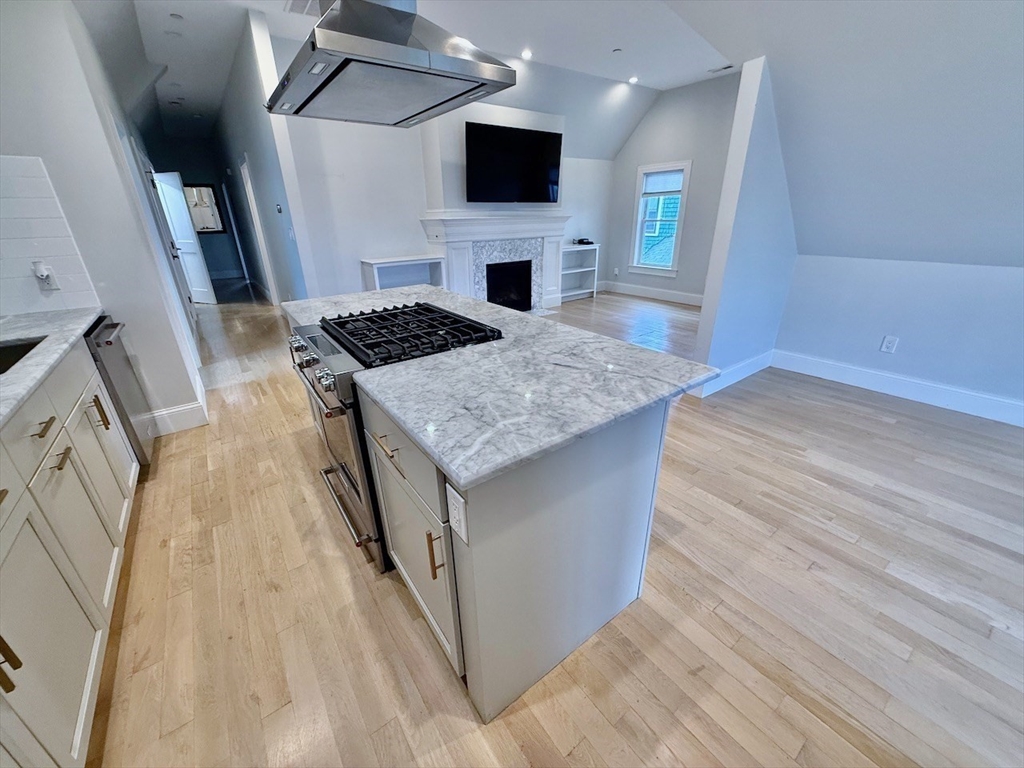 28 Dix Street, Unit 3 Boston, MA 02122 - Photo 9 of 34 a view of a kitchen cabinets and a stove