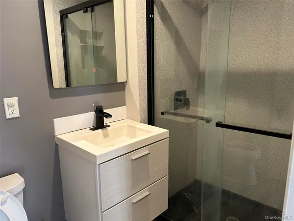 a bathroom with a sink and mirror