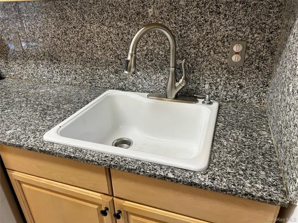 a bath tub sitting in a bathroom and a sink