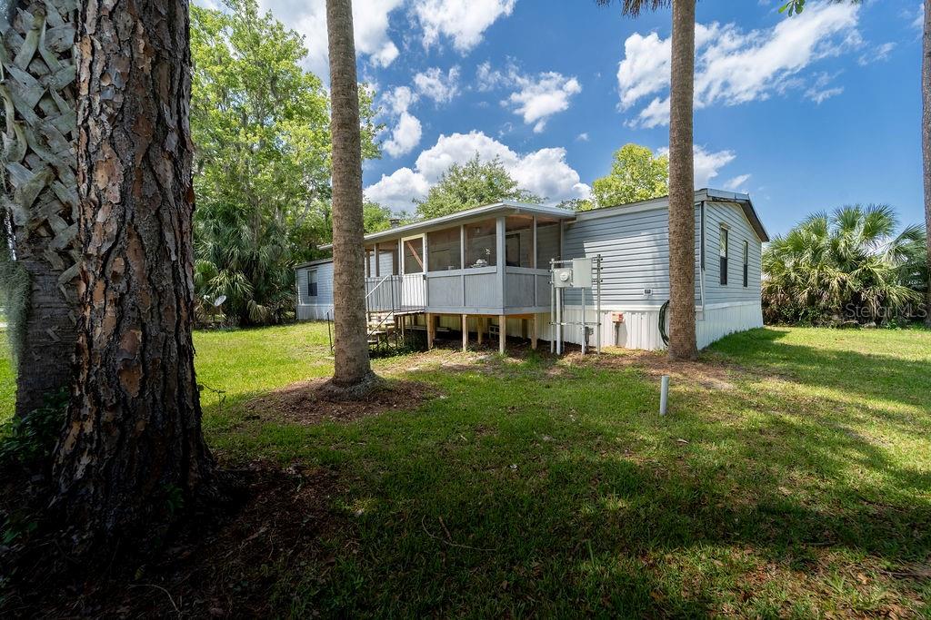 24031 Armadillo Road Astor, FL 32102 - Photo 2 of 43 a view of a house with backyard