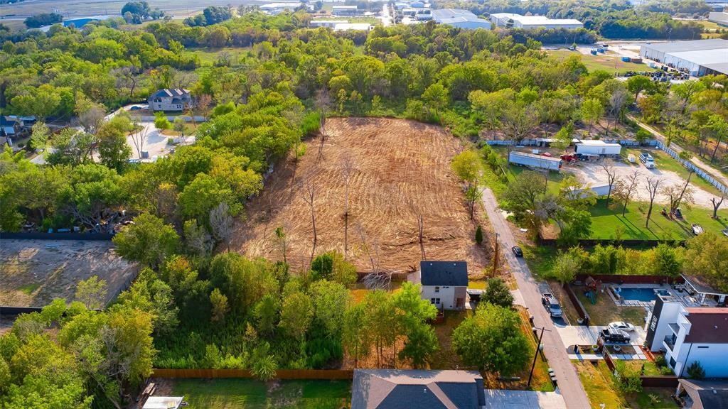 8888 Freeland Street Houston, TX 77075 - Photo 10 of 12 a aerial view of a residential apartment building with a yard and large tree