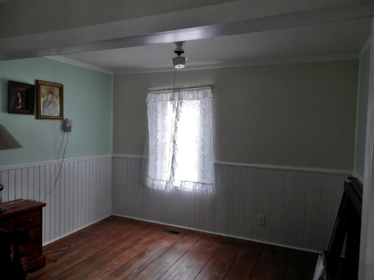 8790 Ruttan Road Northwest Alden, MI 49612 - Photo 16 of 43 Living room with wainscotting