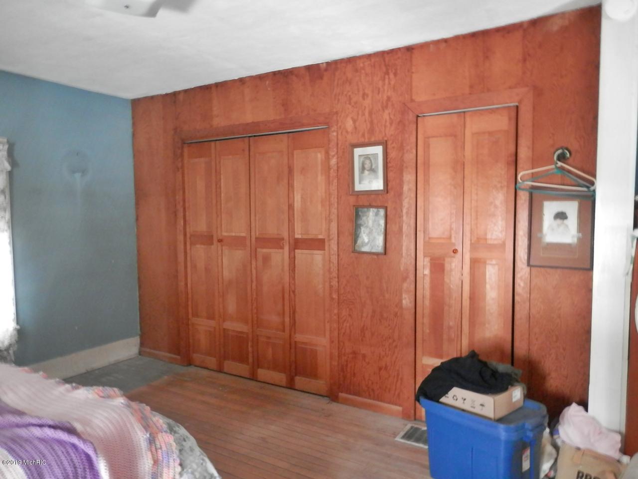 8790 Ruttan Road Northwest Alden, MI 49612 - Photo 23 of 43 Wall of closets in master bedroom