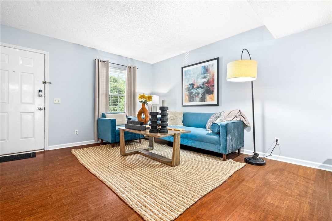 1761 Wire Road, Unit 209 Auburn, AL 36832 - Photo 1 of 26 Open concept living room allows ample space for seating and dining