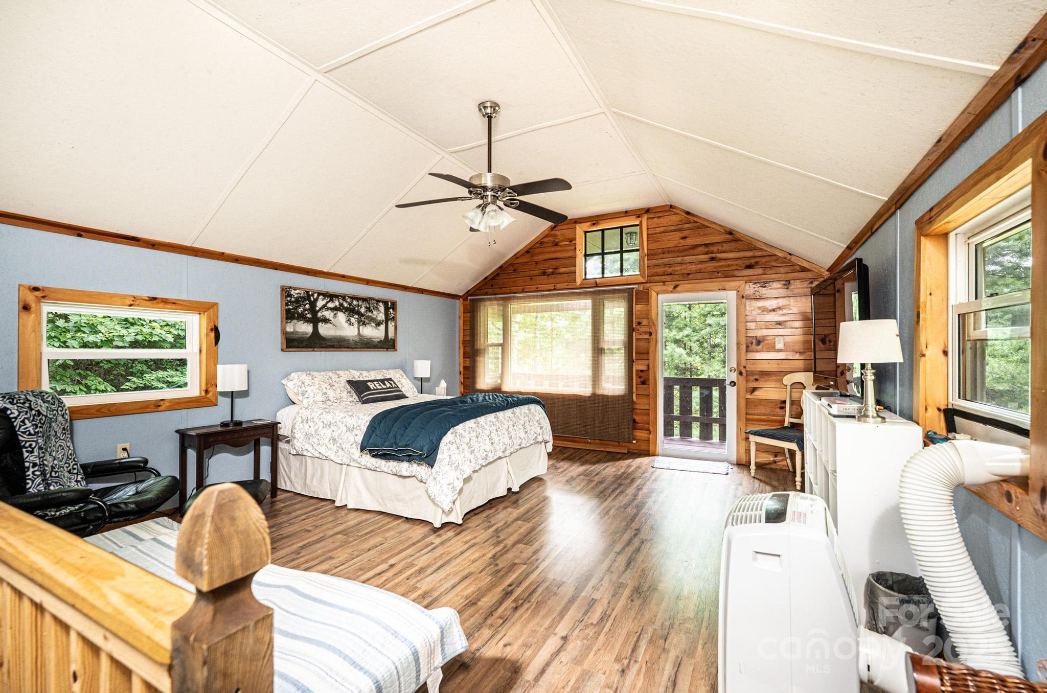 4462 Maple Grove Church Road Collettsville, NC 28611 - Photo 12 of 19 a living room with furniture a flat screen tv and a large window