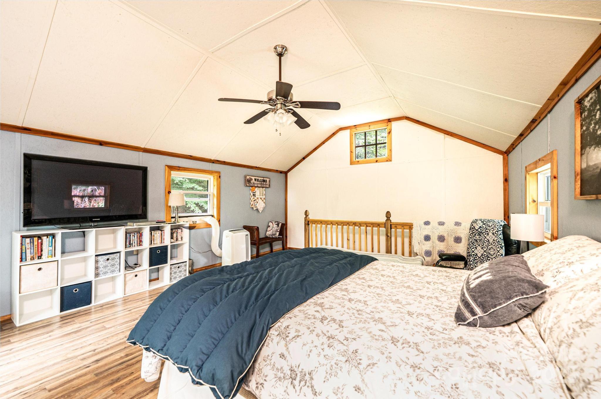 4462 Maple Grove Church Road Collettsville, NC 28611 - Photo 14 of 19 a bedroom with a bed and a flat screen tv