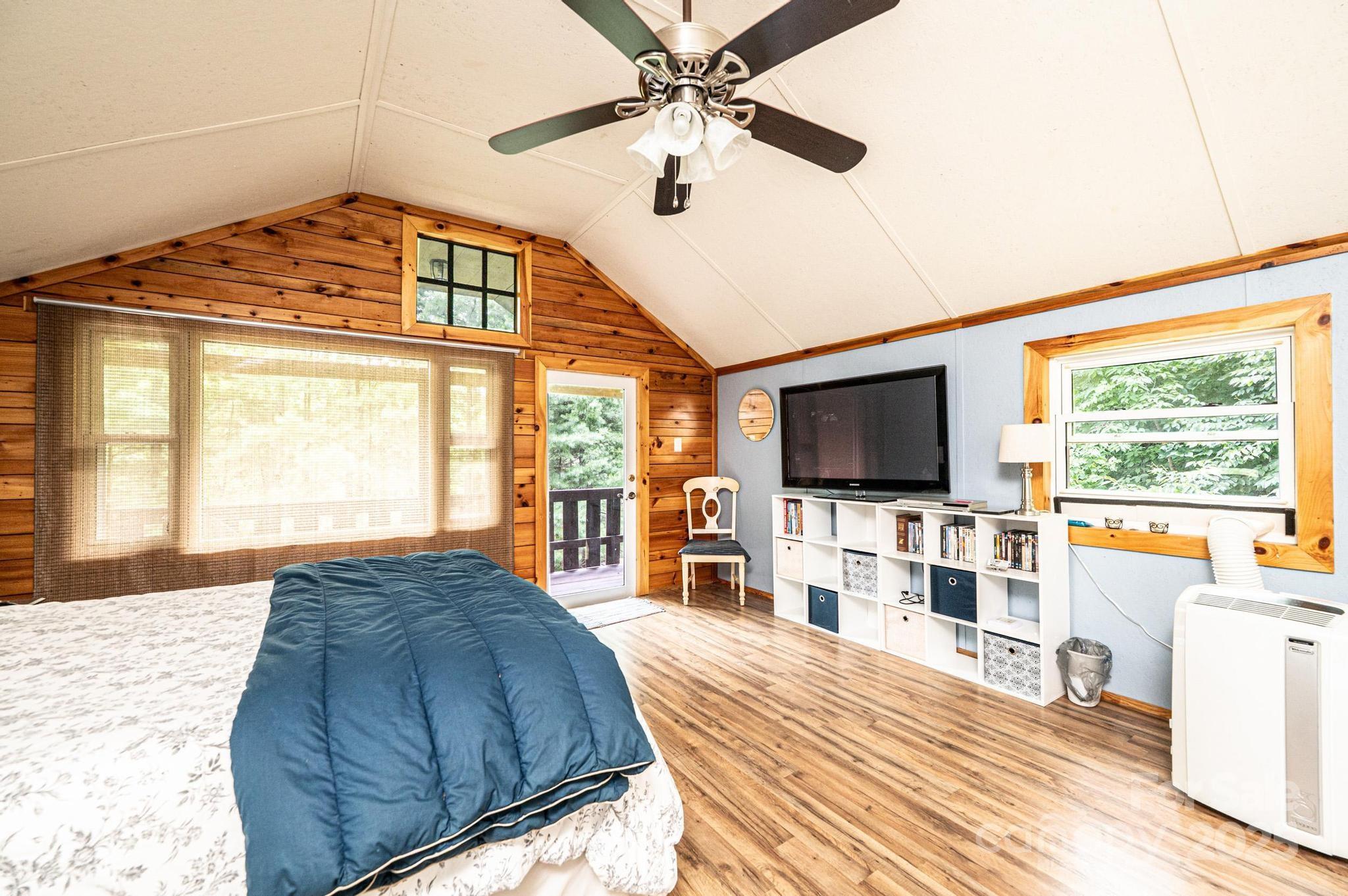 4462 Maple Grove Church Road Collettsville, NC 28611 - Photo 15 of 19 a bedroom with a bed and a flat screen tv