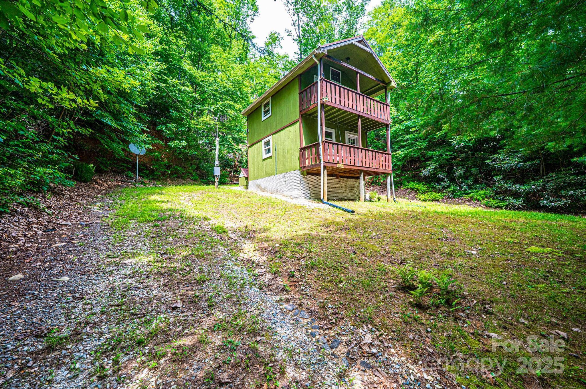 4462 Maple Grove Church Road Collettsville, NC 28611 - Photo 16 of 19 a view of a house with a yard