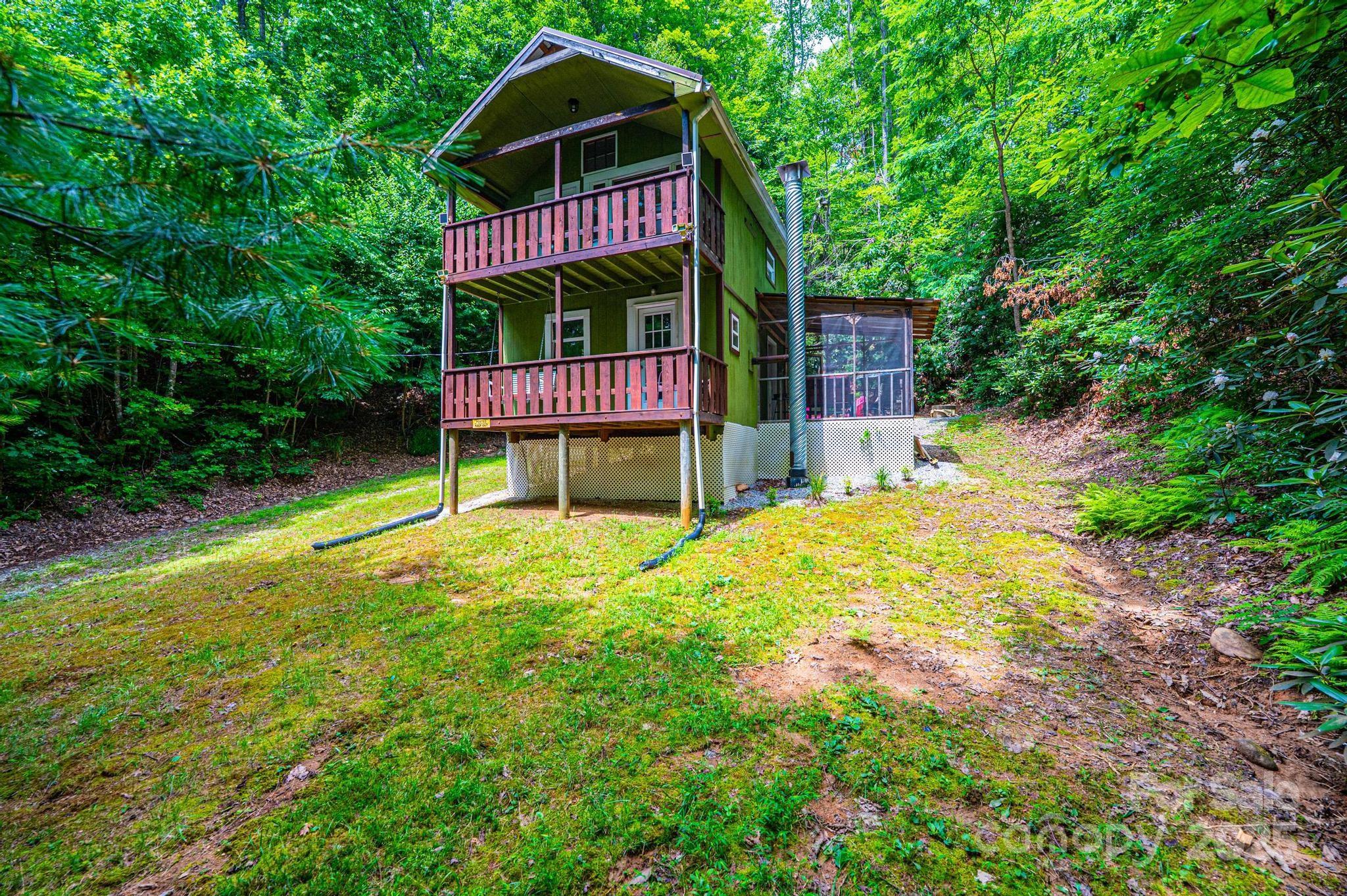 4462 Maple Grove Church Road Collettsville, NC 28611 - Photo 17 of 19 a view of a house with a yard and deck