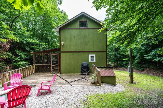 a view of a chair and table in backyard