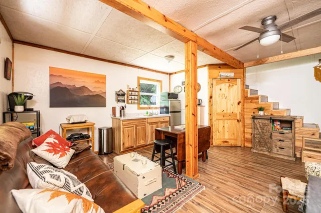 a view of a livingroom with furniture and workspace