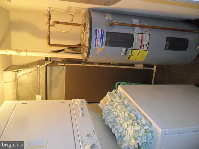 a kitchen with a sink cabinets and appliances