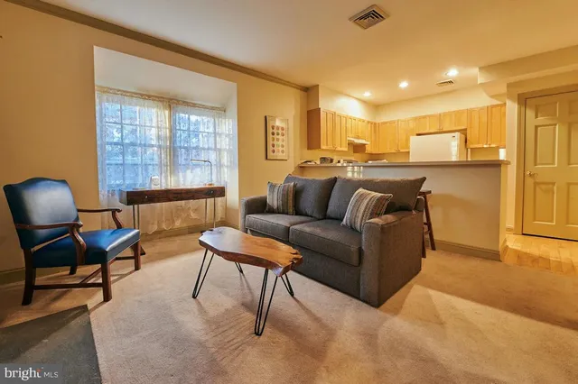 a bedroom with a bed and a chair