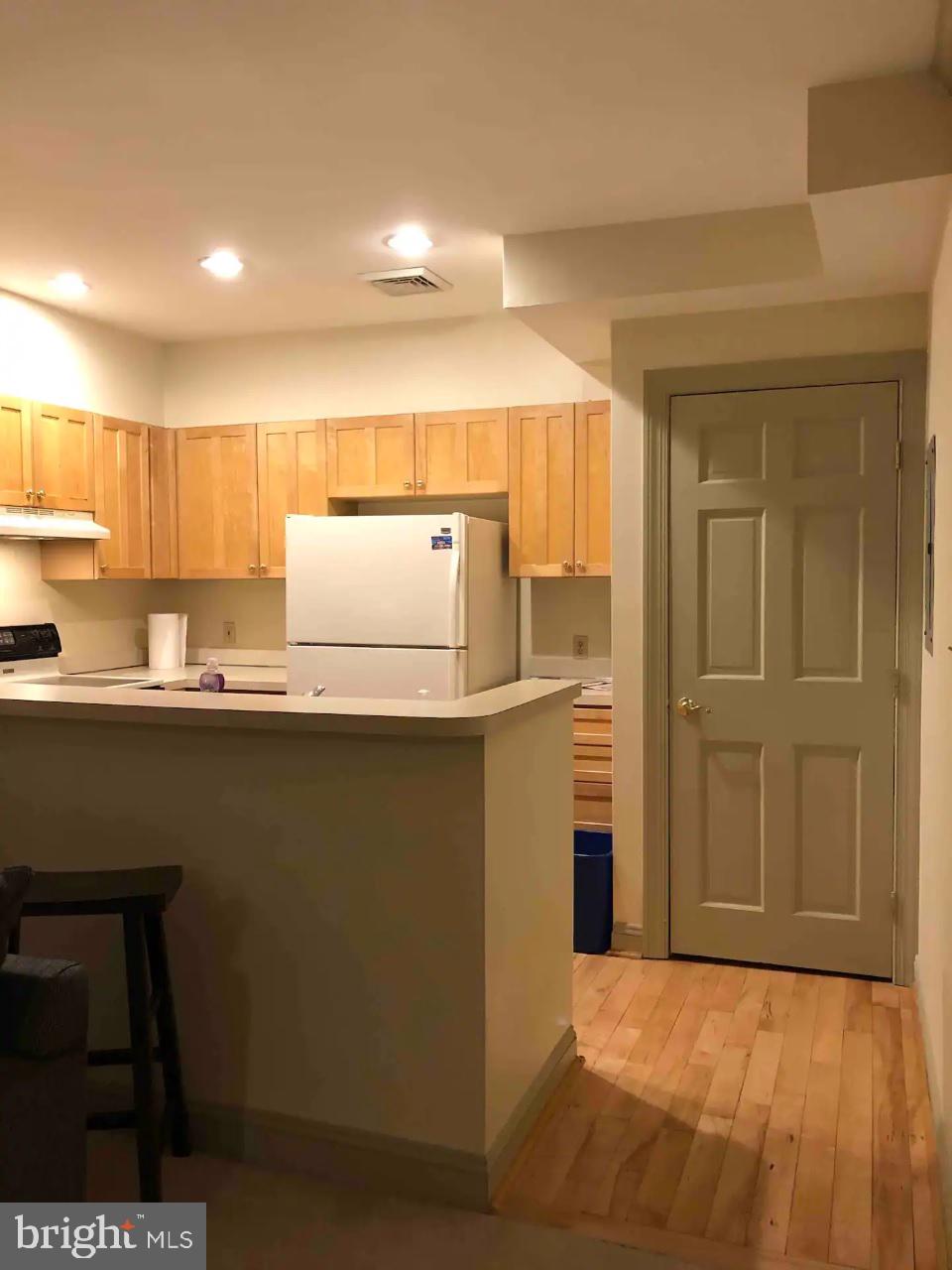9 Delaware Street, Unit 9 New Castle, DE 19720 - Photo 27 of 28 a kitchen with stainless steel appliances granite countertop a refrigerator and a stove