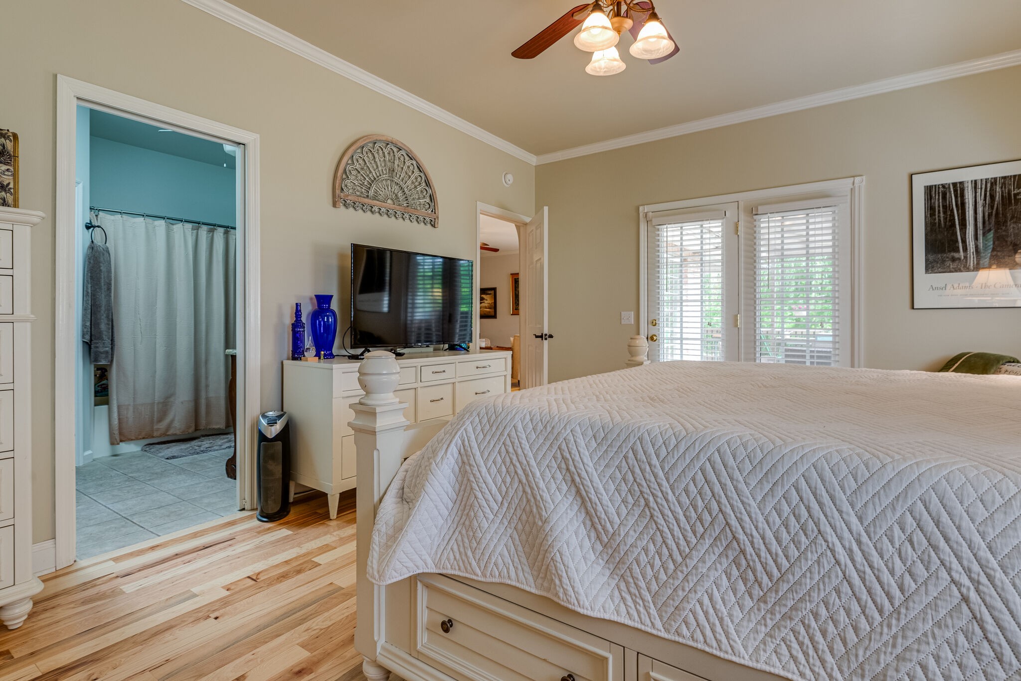 7107 Wells Cemetery Road Dickson, TN 37055 - Photo 18 of 59 a bed sitting in a bedroom and a flat tv screen