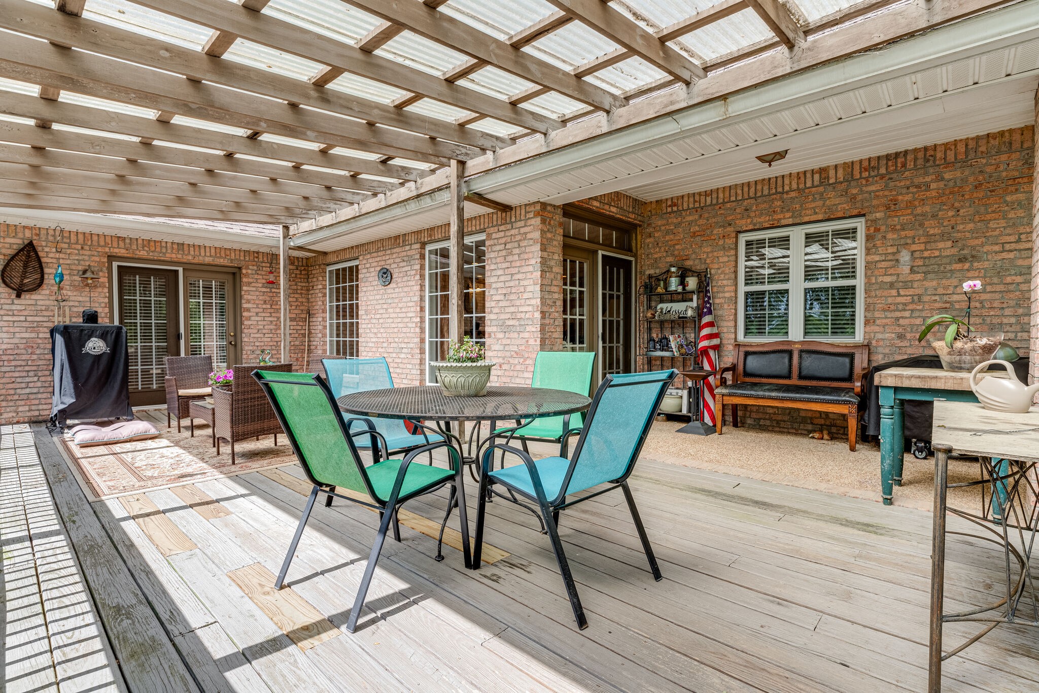 7107 Wells Cemetery Road Dickson, TN 37055 - Photo 53 of 59 a view of a patio with table and chairs and wooden floor